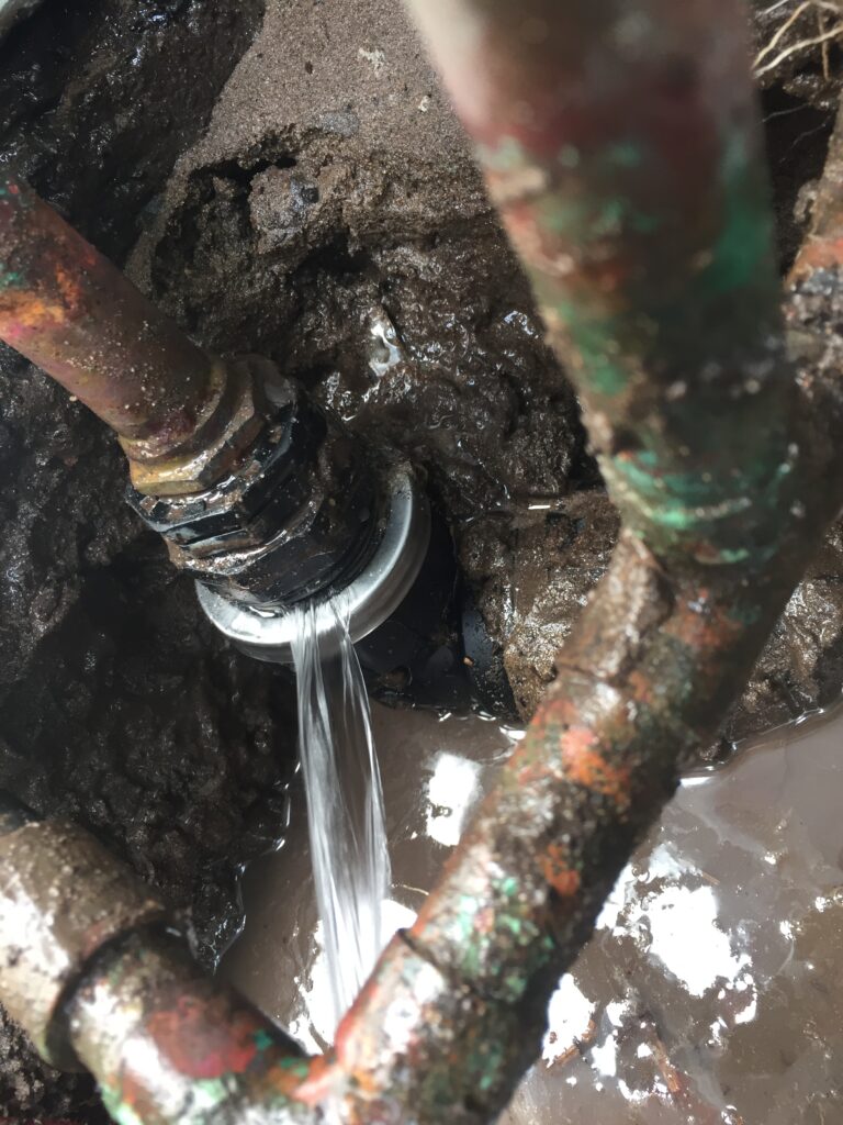 burst water pipe with water coming out
