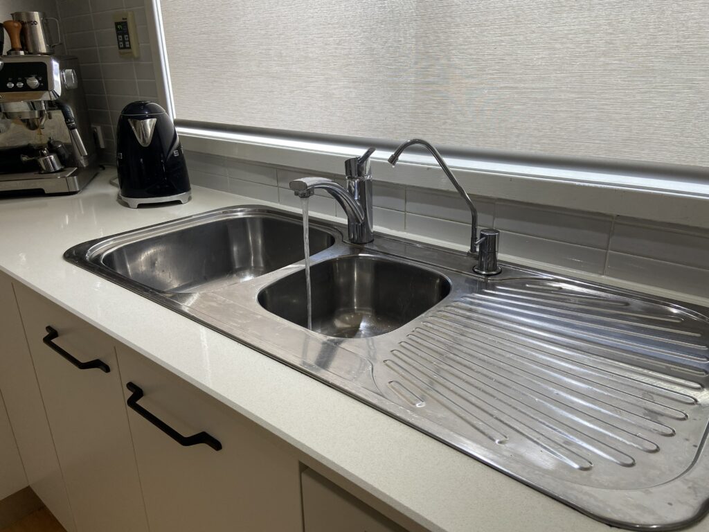 kitchen sink with water running