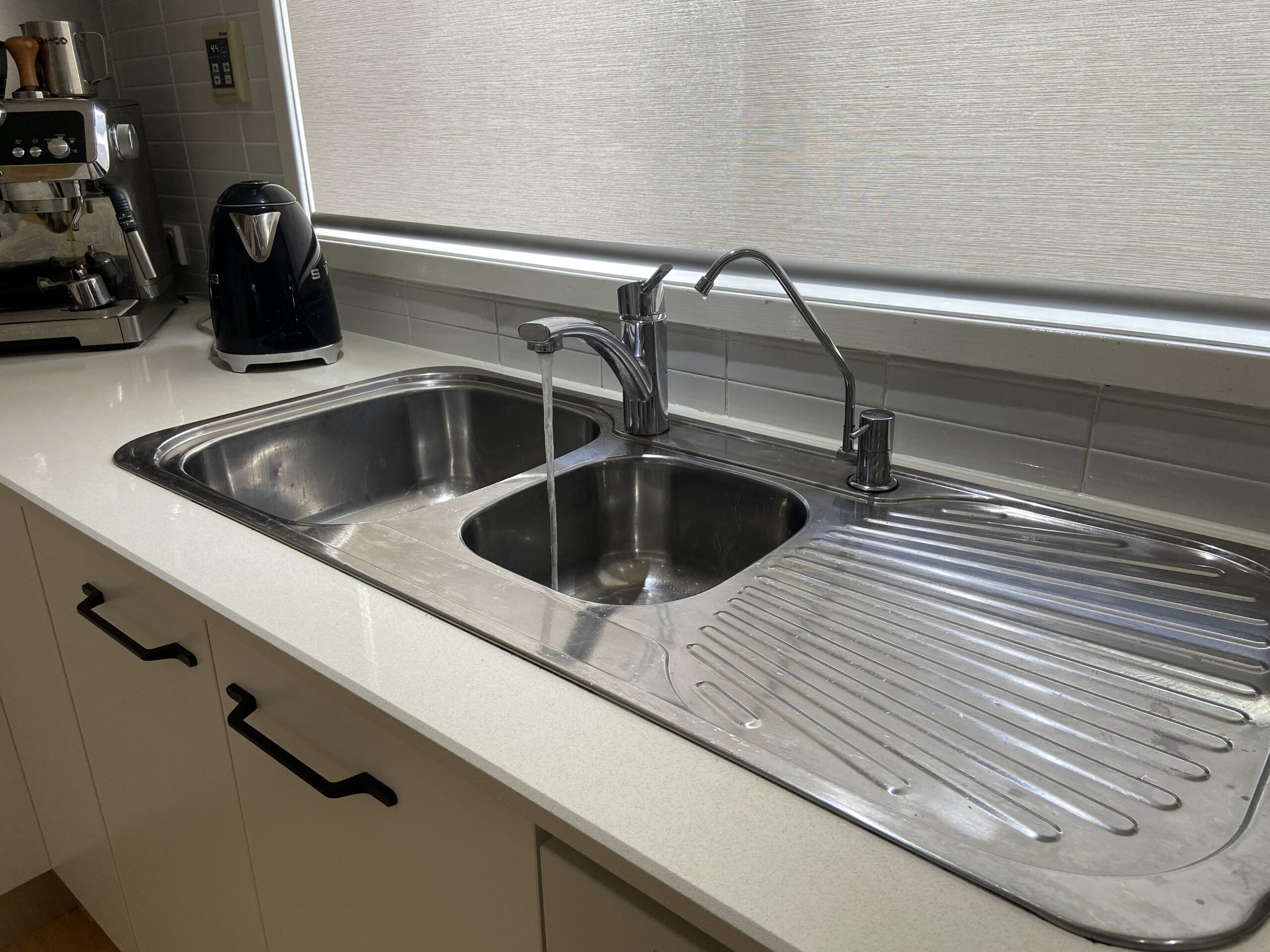 kitchen sink with water running